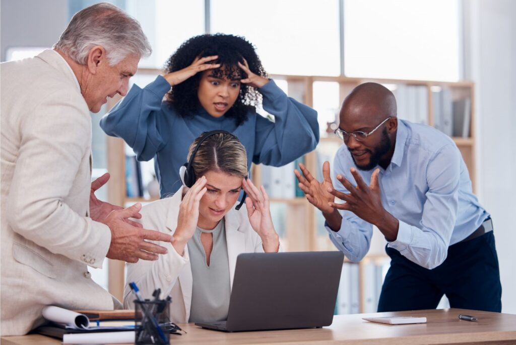 Group of office staff discussing a problem